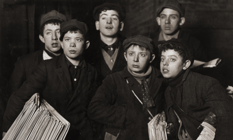 Lewis Hine's photograph titled 'Newsies at Brooklyn Bridge Starting Out at 1 a.m. in a Blizzard on a Sunday'.