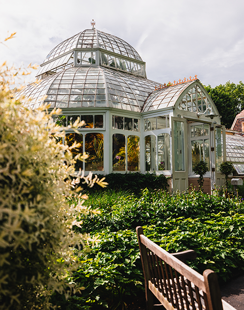 the exterior of a historic greenhouse