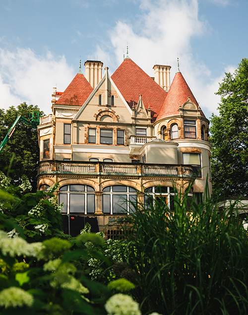 exterior view of a gilded age mansion